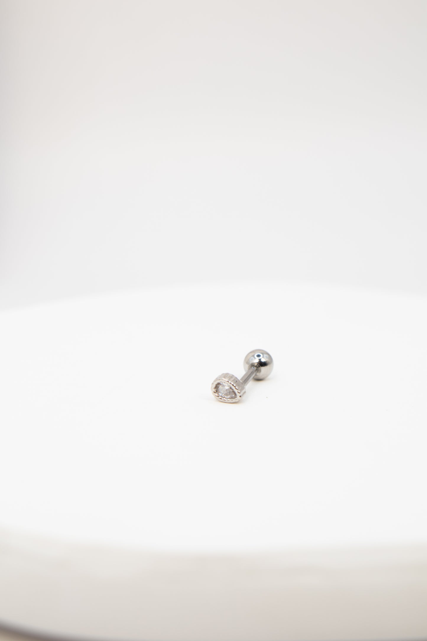 Silver teardrop rhinestone flat back stud earring on a white background