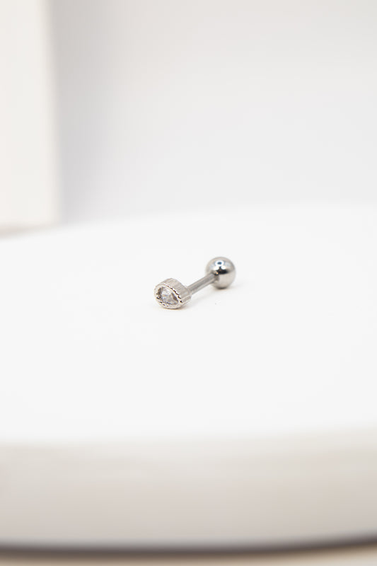 Silver flat back stud earring on a white background