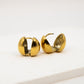 Gold hoop earrings on a white background