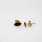 Gold and black earrings on a white background