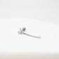 Silver earring on a white background