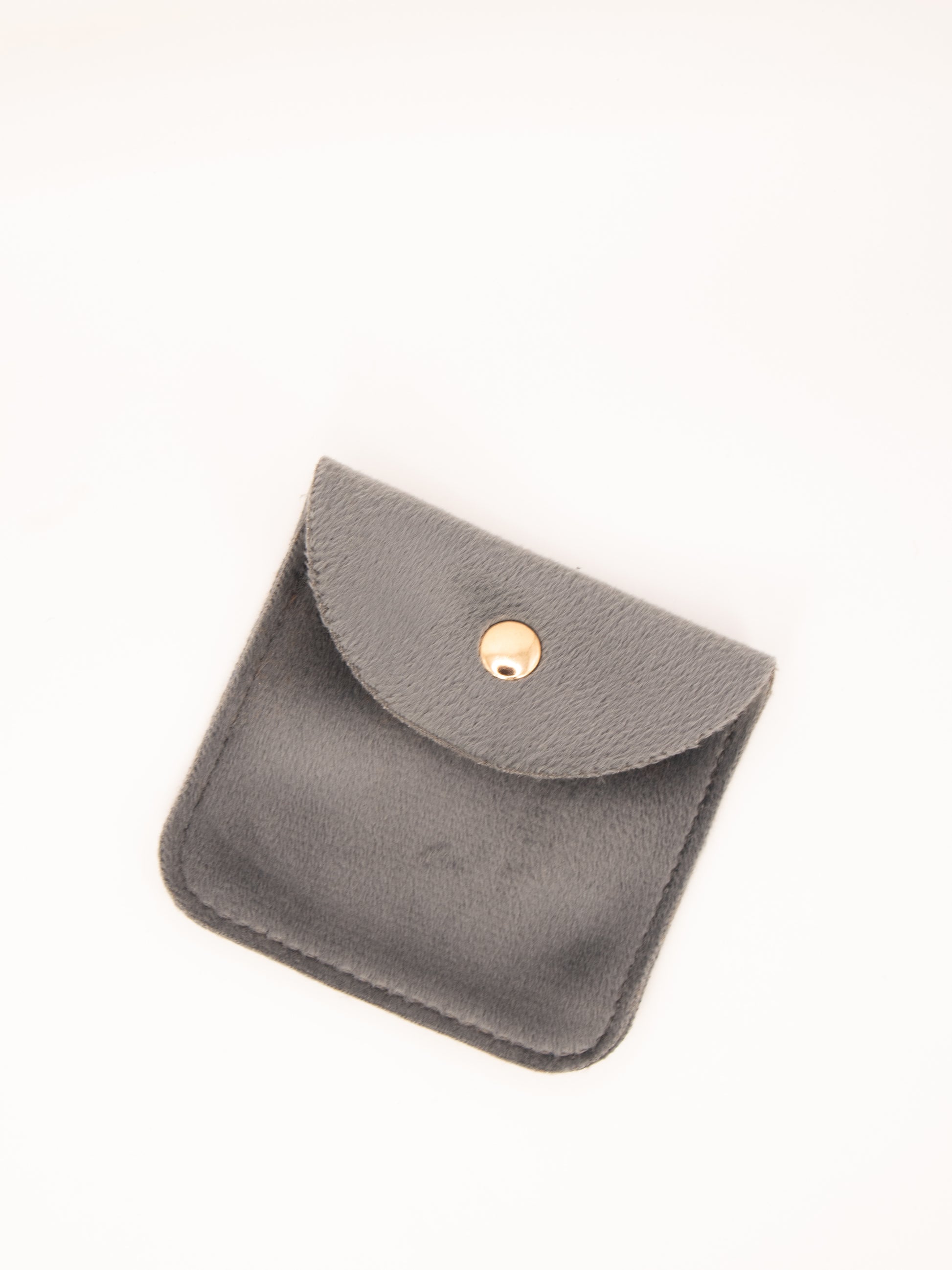 Small gray leather pouch with a gold clasp on a white background