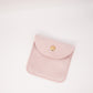 Pink suede pouch with a gold clasp on a white background