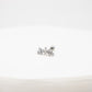 Silver earring on a white background