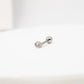 Silver flat back stud earring on a white background